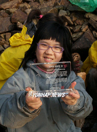 `올해의 환경인에 태안 자원봉사자들