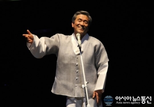 장사익